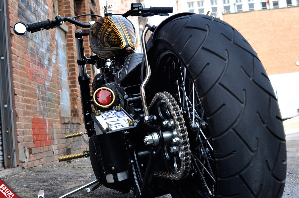 Black motorcycle rear wheel b side