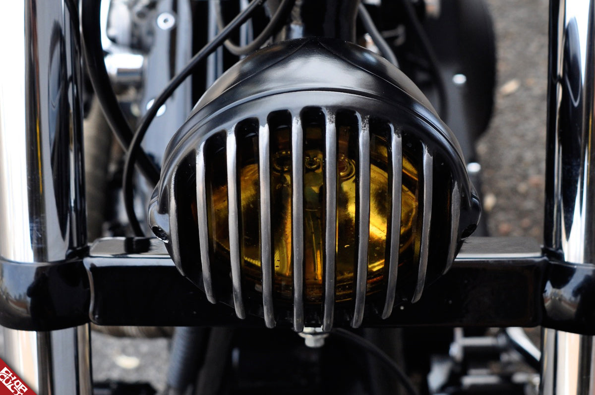 Black motorcycle headlight