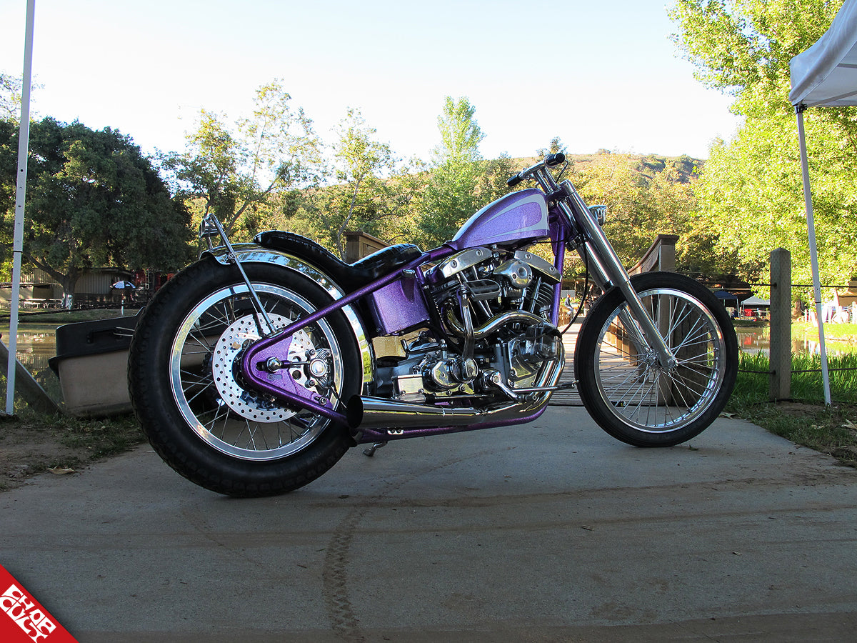 A photo of the purple bike's right side