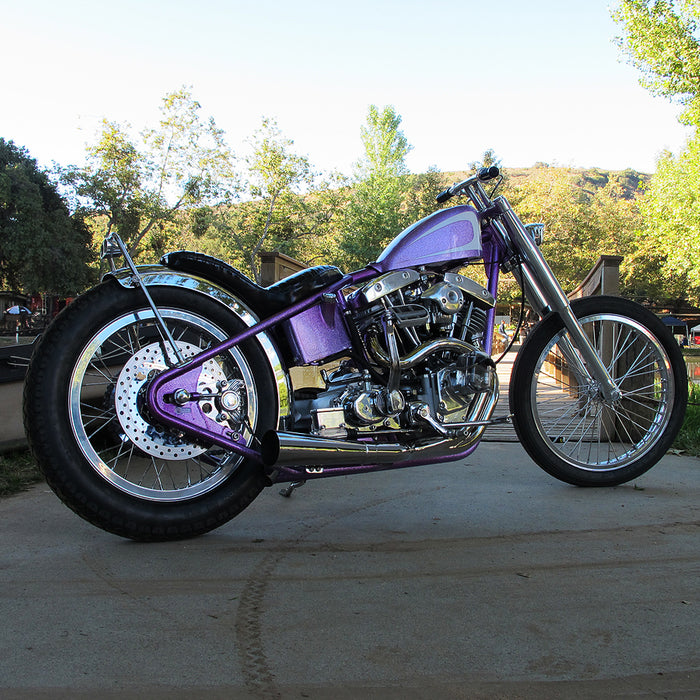 A photo of the purple bike's right side