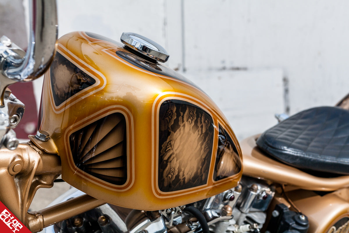 A photo of the bike's oil tank and seat