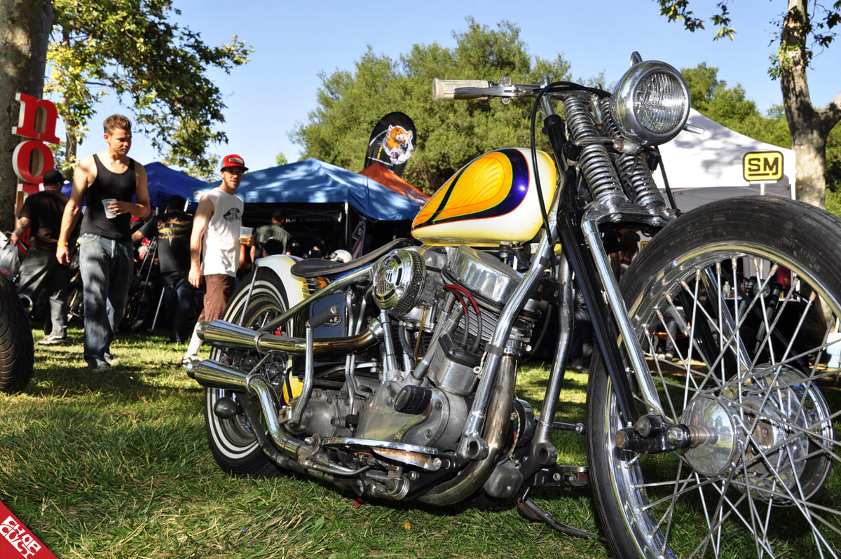 A photo of festival guests looking at Cole's bike in awe