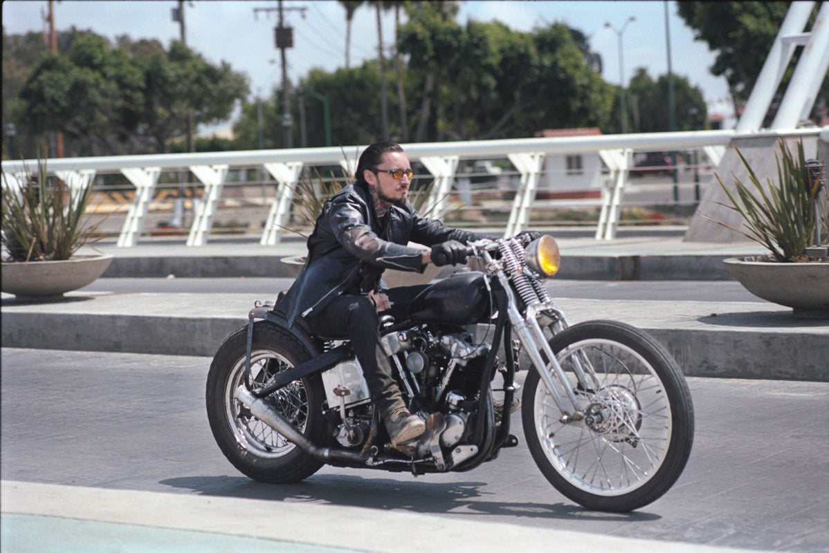Collins riding his bike down the highway