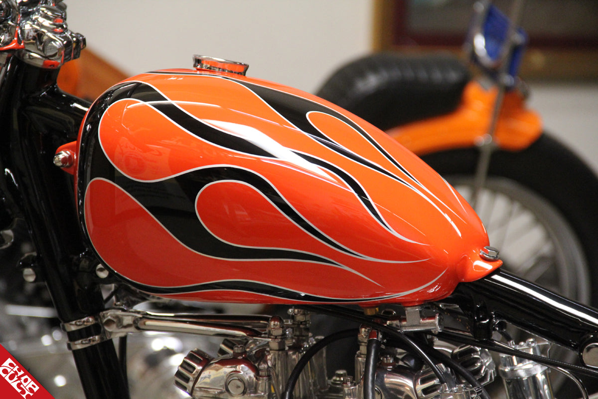 A close up of the paint job, orange with a black flame pattern