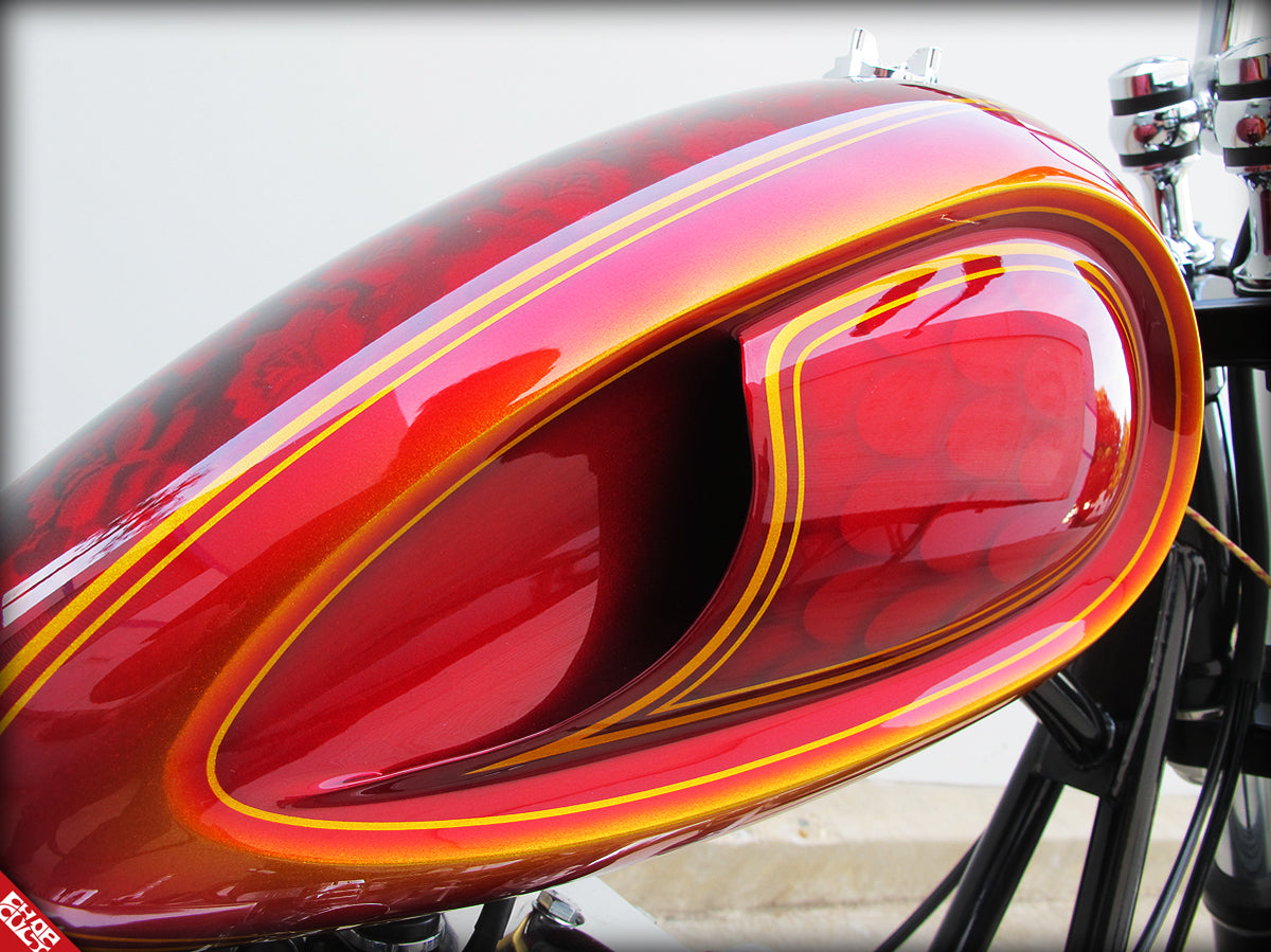 red paint detailing on the side of the fuel tank.